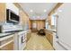 Bright kitchen featuring white appliances, vintage countertops and custom cabinets at 400 N Jay N St, Chandler, AZ 85225