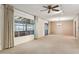 Spacious living room with a large window, neutral walls, and carpet flooring at 400 N Jay N St, Chandler, AZ 85225