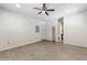 Bright living room features painted brick wall, vinyl floors and ceiling fan at 400 N Jay N St, Chandler, AZ 85225
