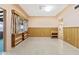 Traditional living room with wood paneled walls and a built in window seat and shelving at 400 N Jay N St, Chandler, AZ 85225