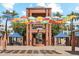 Vibrant Scottsdale public art installation featuring colorful umbrellas and a bronze statue at 400 N Jay N St, Chandler, AZ 85225