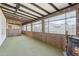 Wood paneled sunroom with carpet, white ceiling and many windows at 400 N Jay N St, Chandler, AZ 85225