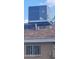 Exterior shot highlighting the efficient rooftop air conditioning unit and secure window at 4008 W El Caminito Dr, Phoenix, AZ 85051