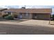 Charming single-story home with neutral-colored siding and well-kept landscaping at 4008 W El Caminito Dr, Phoenix, AZ 85051