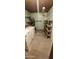 Functional laundry area with a washer, dryer, shelving, and utility hook paneling at 4008 W El Caminito Dr, Phoenix, AZ 85051