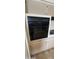The wall oven has a sleek black finish, adding a modern touch to the kitchen at 4008 W El Caminito Dr, Phoenix, AZ 85051