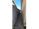 Side yard featuring a concrete path between a block wall and the side of the house at 4008 W El Caminito Dr, Phoenix, AZ 85051