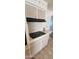 A four-burner stovetop with a black finish integrated into a cream-colored countertop at 4008 W El Caminito Dr, Phoenix, AZ 85051