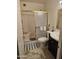 Standard bathroom featuring shower-tub combo with sliding glass doors, a vanity and neutral finishes at 4614 N 19 Ave, Phoenix, AZ 85015