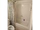 Bathroom featuring a tub and shower combo with a white shower curtain and standard fixtures at 4614 N 19 Ave, Phoenix, AZ 85015
