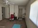 Bedroom with carpet floors, neutral paint, and features a ceiling fan and built-in vanity at 4614 N 19 Ave, Phoenix, AZ 85015