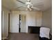 Well-lit bedroom with ceiling fan, carpet, and built-in closet storage, offering a functional living space at 4614 N 19 Ave, Phoenix, AZ 85015