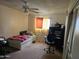 Bedroom featuring neutral decor with a daybed, desk, and ample storage, ideal for a comfortable living space at 4614 N 19 Ave, Phoenix, AZ 85015