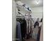 Organized walk-in closet featuring ample storage space with shelving, hanging rods, and personal items at 4614 N 19 Ave, Phoenix, AZ 85015