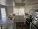 Bright kitchen featuring white cabinets, laminate countertops, and stainless steel appliances at 4614 N 19 Ave, Phoenix, AZ 85015