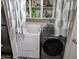 Convenient laundry area with modern washer and dryer set, with additional shelving at 4614 N 19 Ave, Phoenix, AZ 85015