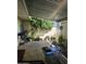 Picturesque covered patio adorned with various potted plants, creating a serene outdoor oasis at 4614 N 19 Ave, Phoenix, AZ 85015