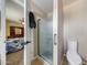 Bright bathroom featuring a glass enclosed shower and convenient access to the bedroom at 4808 W Shaw Butte Dr, Glendale, AZ 85304