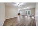 Inviting living room with luxury vinyl flooring and open floor plan to the kitchen at 4808 W Shaw Butte Dr, Glendale, AZ 85304
