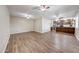 Spacious living room featuring luxury vinyl flooring and open floor plan into the kitchen at 4808 W Shaw Butte Dr, Glendale, AZ 85304