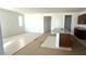 Open-concept layout showing kitchen island with granite countertop and space for living area at 5633 S 253Rd Ave, Buckeye, AZ 85326