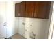 A utility or laundry room with white walls, and hookups for washing machine and dryer at 5633 S 253Rd Ave, Buckeye, AZ 85326