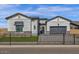 Charming exterior with manicured lawn and dark metal fencing adding to its appeal at 5749 E Sanford St, Mesa, AZ 85215