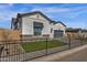 Beautiful home exterior with dark metal fencing and desert landscaping at 5749 E Sanford St, Mesa, AZ 85215