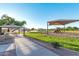 Community park featuring playgrounds, picnic benches, and a large open grassy area at 5749 E Sanford St, Mesa, AZ 85215