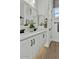 Bright bathroom with double sinks, white marble countertops, and black fixtures at 5756 E Star Valley St, Mesa, AZ 85215