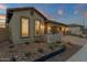 The house showcases decorative rock landscaping with planter boxes along its facade at 5756 E Star Valley St, Mesa, AZ 85215
