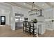 Bright kitchen with stainless steel appliances, a large island with seating, and stylish pendant lighting at 5756 E Star Valley St, Mesa, AZ 85215