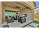 Inviting covered patio with brick fireplace and comfortable seating area at 5756 E Star Valley St, Mesa, AZ 85215