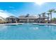 Community pool featuring a zero entry and shaded seating, ideal for Gathering fun and relaxation at 5756 E Star Valley St, Mesa, AZ 85215
