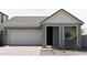 Charming home featuring a two-car garage, neutral paint, gray roof, and minimalist landscaping at 5916 S Daisy Patch Pl, Phoenix, AZ 85040