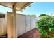 Exterior view of enclosed backyard with brick pathway and mature landscaping at 5942 N 83Rd St, Scottsdale, AZ 85250