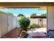 Enclosed backyard featuring brick pavers, lush landscaping, and gated access at 5942 N 83Rd St, Scottsdale, AZ 85250