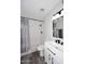 Bathroom with white tiled shower, modern vanity, and matte black finishes at 5942 N 83Rd St, Scottsdale, AZ 85250