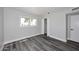 Clean and bright bedroom featuring hard surface floors, baseboards and closet at 5942 N 83Rd St, Scottsdale, AZ 85250