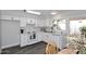 Bright kitchen featuring white cabinets, modern countertops, and modern flooring with stainless steel dishwasher at 5942 N 83Rd St, Scottsdale, AZ 85250