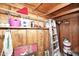 Storage shed with shelves and a ladder, offering practical organization space at 5942 N 83Rd St, Scottsdale, AZ 85250