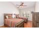 Guest bedroom featuring two twin beds, wood blinds and a ceiling fan at 6122 E Saddleback St, Mesa, AZ 85215