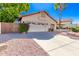 Charming single Gathering home with desert landscaping and a two car garage at 6122 E Saddleback St, Mesa, AZ 85215
