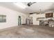 Spacious garage with storage cabinets, workbench, and utility sink at 6122 E Saddleback St, Mesa, AZ 85215