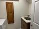 A functional laundry room area includes built-in cabinets, a sink, and a stylish countertop for added convenience at 6122 E Saddleback St, Mesa, AZ 85215