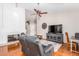 Living room with tile floors, vaulted ceiling, modern TV, fireplace and furniture at 6122 E Saddleback St, Mesa, AZ 85215