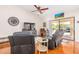 Comfortable living room with tile floors, furniture and access to patio with pool at 6122 E Saddleback St, Mesa, AZ 85215