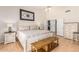 Bright main bedroom featuring vaulted ceilings, and a light tile floor and a comfy bed at 6122 E Saddleback St, Mesa, AZ 85215