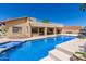 Inviting backyard oasis features a large pool and spa, perfect for relaxation and entertaining at 6122 E Saddleback St, Mesa, AZ 85215