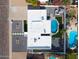 Aerial view of the home showing landscaping and the gorgeous pool with sitting area and lounging options at 6539 E Sharon Dr, Scottsdale, AZ 85254